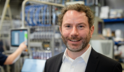 Stephan Bahr, CEO of Hassia-Redatron, smiles at the camera.