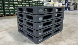 Side view of five plastic keg pallets stacked on top of each other.