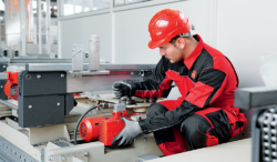 Technician working on the modernization of a drive system as part of a retrofit project.