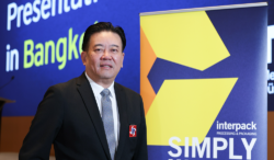 Utsahajit Wiwat, President of the regional industry association Thai Packaging Association, smiling at the camera.